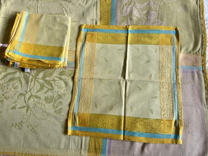 Nappe Françoise Saget et 8 serviettes, aux couleurs vert et ocre, en coton