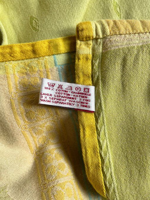 Nappe Françoise Saget et 8 serviettes, aux couleurs vert et ocre, en coton