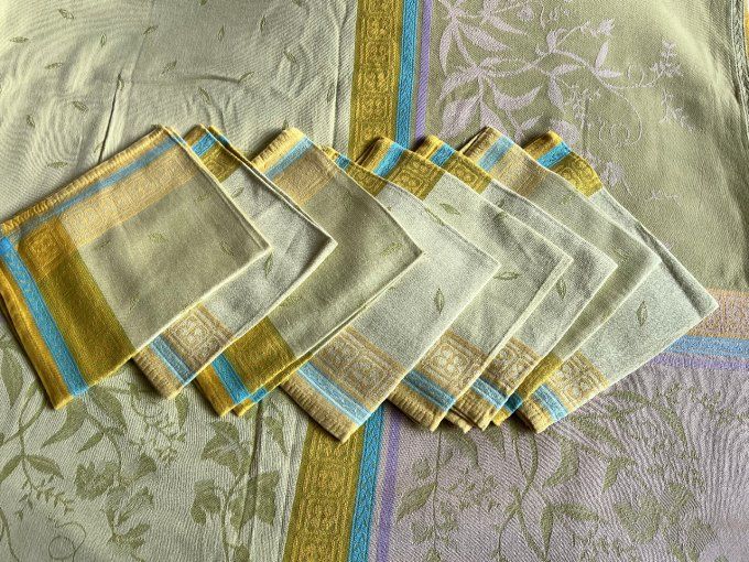 Nappe Françoise Saget et 8 serviettes, aux couleurs vert et ocre, en coton